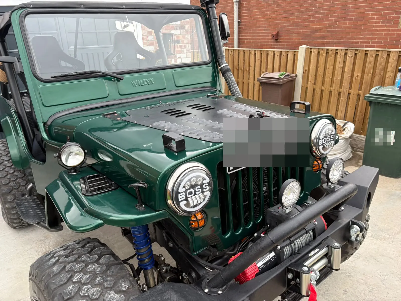 The finished Jeep from above the front wing, showing the vented bonnet panel and round headlights