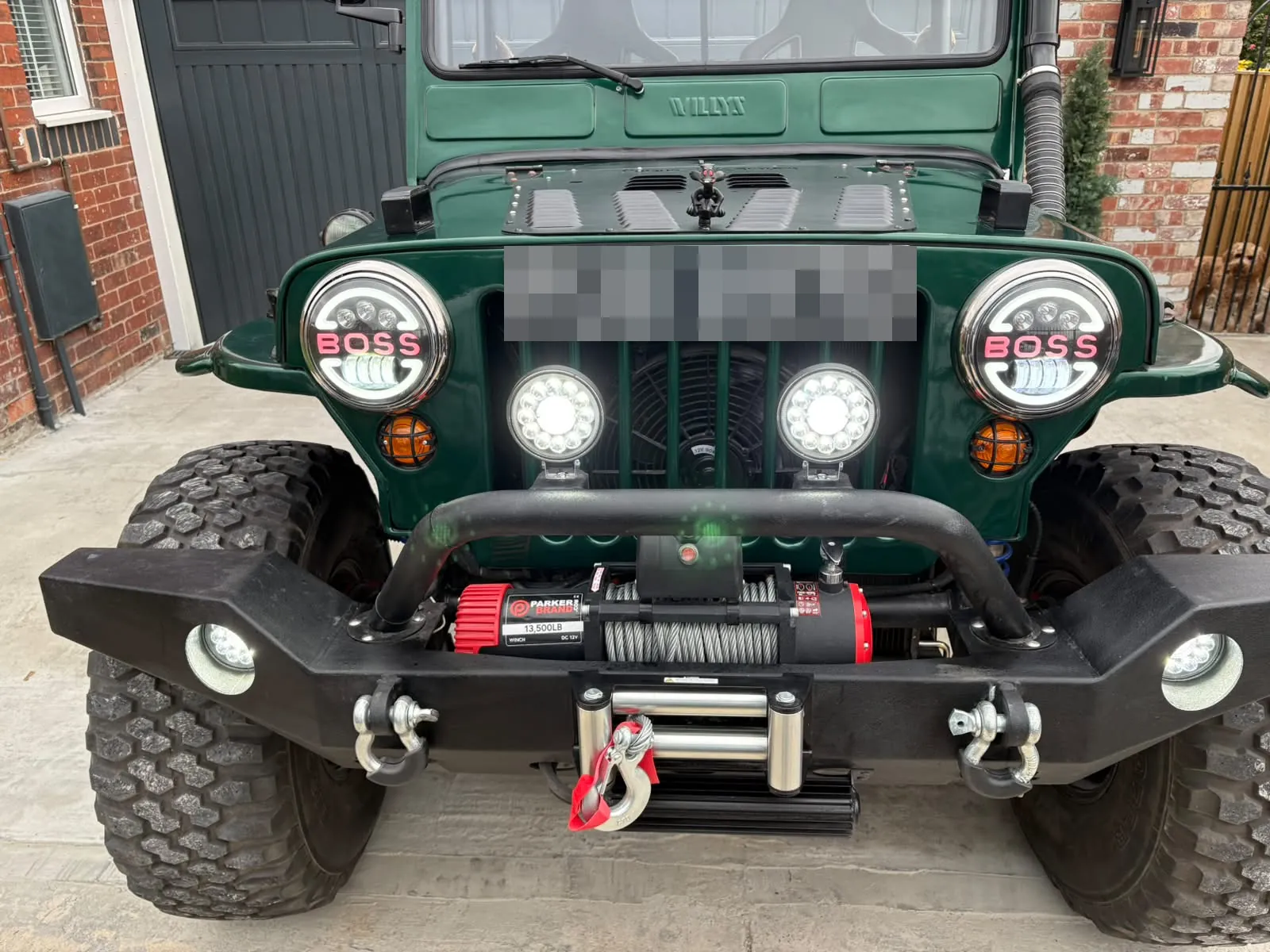 The finished Jeep straight on, with all its front lights on
